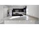 Modern kitchen featuring dark cabinetry, stainless steel appliances, and granite countertops at 514 Eagle Landing Blvd, Winter Haven, FL 33880