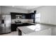 Bright kitchen showcasing stainless steel appliances and gray countertops at 514 Eagle Landing Blvd, Winter Haven, FL 33880