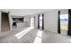Bright living room featuring open floor plan, stairs to the second level, and a modern kitchen at 514 Eagle Landing Blvd, Winter Haven, FL 33880