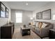 Cozy living room featuring a comfortable sofa, stylish coffee table, and natural light at 514 Eagle Landing Blvd, Winter Haven, FL 33880