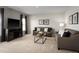 Cozy living room featuring neutral-toned furniture, decorative pillows, and modern decor at 514 Eagle Landing Blvd, Winter Haven, FL 33880