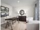 Home office area with modern furniture, a desk, and decorative wall art at 514 Eagle Landing Blvd, Winter Haven, FL 33880