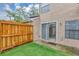 Small fenced patio area with sliding glass doors at 602 Casa Park Court O, Winter Springs, FL 32708