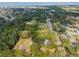 Aerial view of property with white border showing the property's large lot and surrounding greenery at 632 Tildenville School Rd, Winter Garden, FL 34787