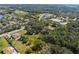 Aerial shot of the property showcasing its expansive lot, mature trees, and proximity to neighborhood amenities at 632 Tildenville School Rd, Winter Garden, FL 34787