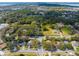 An aerial view highlights the home's location within a lush, tree-filled neighborhood at 632 Tildenville School Rd, Winter Garden, FL 34787
