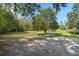Lush backyard offers mature trees, a storage shed and lots of room at 632 Tildenville School Rd, Winter Garden, FL 34787