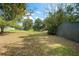 Spacious backyard featuring mature trees, a storage shed, and ample space at 632 Tildenville School Rd, Winter Garden, FL 34787