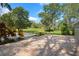 Spacious backyard featuring brick patio and mature shade trees at 632 Tildenville School Rd, Winter Garden, FL 34787