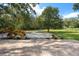 Expansive backyard features brick patio, large trees and storage shed at 632 Tildenville School Rd, Winter Garden, FL 34787
