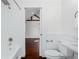 Bathroom showcasing tub, toilet and doorway to bedroom at 632 Tildenville School Rd, Winter Garden, FL 34787