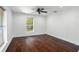 Bedroom with hardwood floors, window with blinds, and a ceiling fan at 632 Tildenville School Rd, Winter Garden, FL 34787