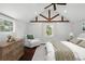 Bright bedroom features vaulted ceilings, exposed beams, and warm accents at 632 Tildenville School Rd, Winter Garden, FL 34787