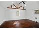 Vaulted bedroom showcasing wood beams, wood floors and bright windows at 632 Tildenville School Rd, Winter Garden, FL 34787