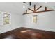 Bright bedroom featuring warm wood floors, ceiling fan and multiple windows at 632 Tildenville School Rd, Winter Garden, FL 34787