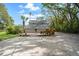 Two story home with a covered back porch and well manicured lawn at 632 Tildenville School Rd, Winter Garden, FL 34787