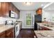 Well-lit kitchen with wood cabinets, granite counters, stainless steel appliances, and a window view at 632 Tildenville School Rd, Winter Garden, FL 34787