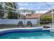 Relaxing poolside deck with lounge seating and blue-tiled trim at 637 W Artesia St, Oviedo, FL 32765