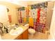 Well-lit bathroom featuring decorative shower curtain, vanity, and ample counter space at 742 Seneca Meadows Rd, Winter Springs, FL 32708