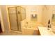 Relaxing bathroom with a glass enclosed shower and a large jetted tub for ultimate comfort at 742 Seneca Meadows Rd, Winter Springs, FL 32708