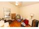 Bedroom with hardwood floors, chair, and a window at 742 Seneca Meadows Rd, Winter Springs, FL 32708