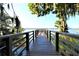 Scenic view of the serene lake from the private dock, offering a tranquil waterfront experience at 742 Seneca Meadows Rd, Winter Springs, FL 32708