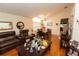Spacious living room featuring wood floors and an open layout leading to the dining area at 742 Seneca Meadows Rd, Winter Springs, FL 32708