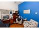 Office space featuring an accent wall, desk, chair, and coastal-themed seating at 742 Seneca Meadows Rd, Winter Springs, FL 32708