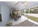 Spacious screened-in patio with ceiling fans and outdoor seating, perfect for relaxing and entertaining at 742 Seneca Meadows Rd, Winter Springs, FL 32708