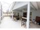 Covered outdoor patio with ample space for dining and grilling, ideal for enjoying the backyard at 742 Seneca Meadows Rd, Winter Springs, FL 32708