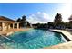 Sparkling community pool with ample lounge chairs and a splash pad, perfect for relaxation and fun in the sun at 742 Seneca Meadows Rd, Winter Springs, FL 32708