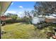 Spacious backyard featuring a shed, gardening area, and grassy lawn at 783 Cornelia Ct, Orlando, FL 32811