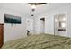 Bright bedroom with a large TV and a neutral color scheme at 783 Cornelia Ct, Orlando, FL 32811