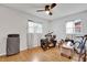 Bedroom with wood floors, ceiling fan, and natural light from two windows at 783 Cornelia Ct, Orlando, FL 32811