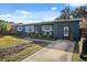 This is a charming one-story home showcasing a driveway and an attached garage, with yard at 783 Cornelia Ct, Orlando, FL 32811