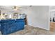 Open living room with tile floors and a blue sofa near the entry at 783 Cornelia Ct, Orlando, FL 32811