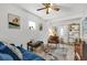 Bright living room with stylish decor, tile floor, and comfortable seating at 783 Cornelia Ct, Orlando, FL 32811