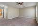 Large main bedroom featuring neutral paint, plush carpeting, and a ceiling fan at 8008 Page Ct, Haines City, FL 33844