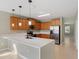 Modern kitchen with stainless steel appliances, pendant lighting and breakfast bar at 8008 Page Ct, Haines City, FL 33844