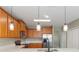 Bright kitchen features stainless steel appliances, solid surface countertops, and wood cabinets at 8008 Page Ct, Haines City, FL 33844
