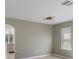 Open-concept space with tile flooring that looks to a kitchen and a window with natural light at 8008 Page Ct, Haines City, FL 33844