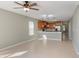Inviting open-concept space offering tile flooring, neutral paint, and access to the kitchen at 8008 Page Ct, Haines City, FL 33844