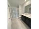 Main bathroom with double vanity and a large walk-in shower at 1148 Pomelo St, Davenport, FL 33837