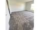 Spacious bedroom with grey carpet and neutral walls at 1148 Pomelo St, Davenport, FL 33837