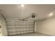 Attached garage with white walls and automatic door opener at 1148 Pomelo St, Davenport, FL 33837
