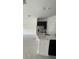 Modern kitchen features island, stainless steel appliances, and dark cabinetry at 1148 Pomelo St, Davenport, FL 33837
