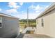Backyard featuring a partial fence, a view of a pond, and a landscaped area at 11842 Sunsail Ave, Orlando, FL 32832
