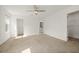 Bright, spacious bedroom with carpet floors, ceiling fan, and ensuite bathroom access at 11842 Sunsail Ave, Orlando, FL 32832