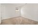 Cozy bedroom with neutral carpet and a window, providing a comfortable space at 11842 Sunsail Ave, Orlando, FL 32832