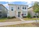 Attractive two-story home with a well-maintained lawn and garden beds at 11842 Sunsail Ave, Orlando, FL 32832